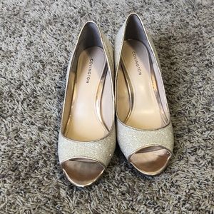 Covington size 7.5 glittery gold heels.